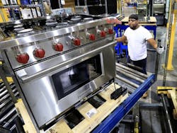 A Wolf range from Sub-Zero moving through the assembly process.